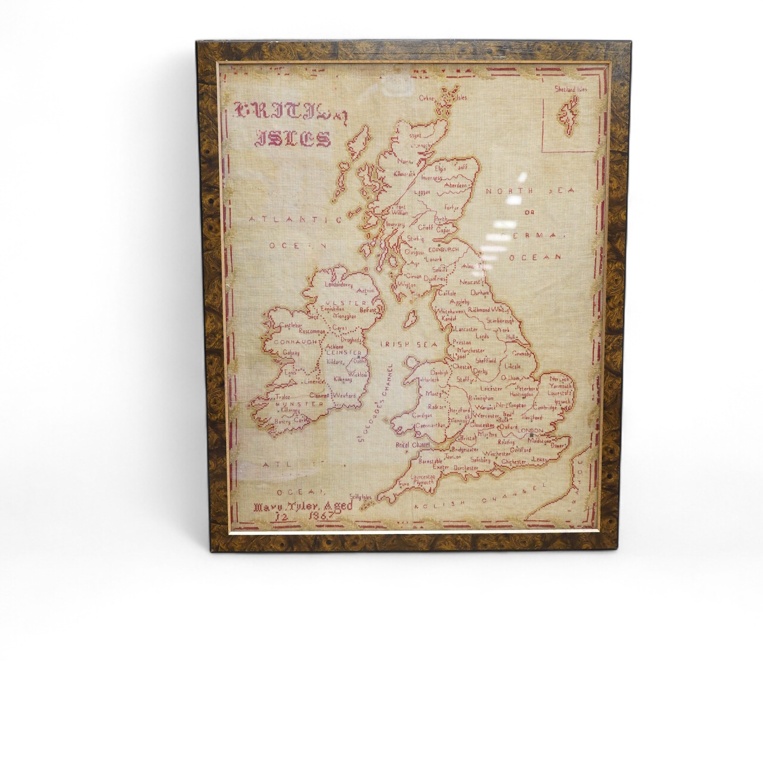 A 19th century red and green cross stitch sampler of The British Isles, by Mary Tyler aged 12 years. 65cm high x 52cm wide